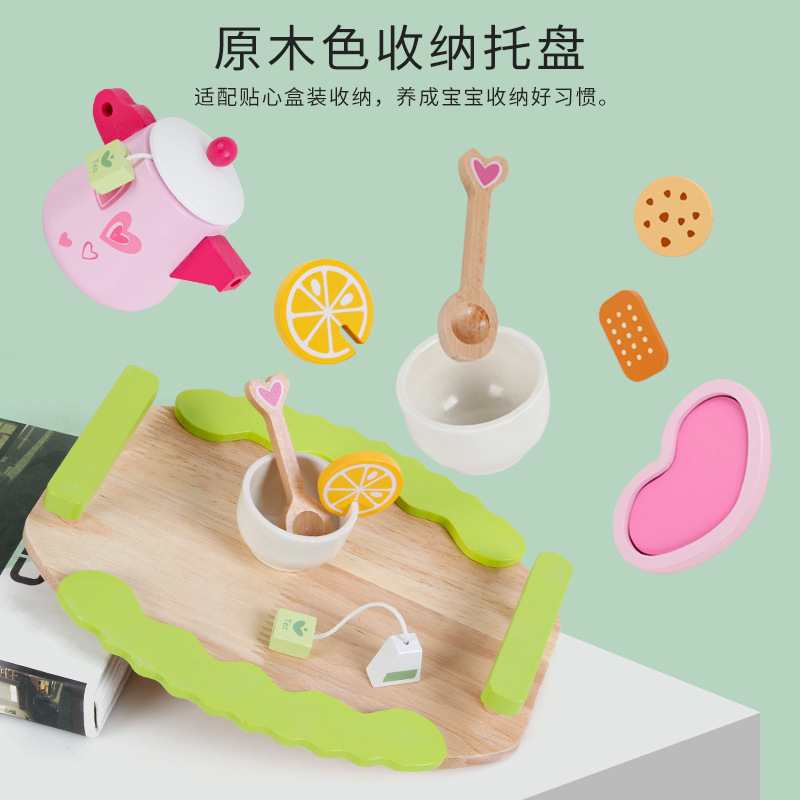 Wooded past home with a tea and dessert set to play the role of a child in the kitchen, imitating a real-life interactive toy.