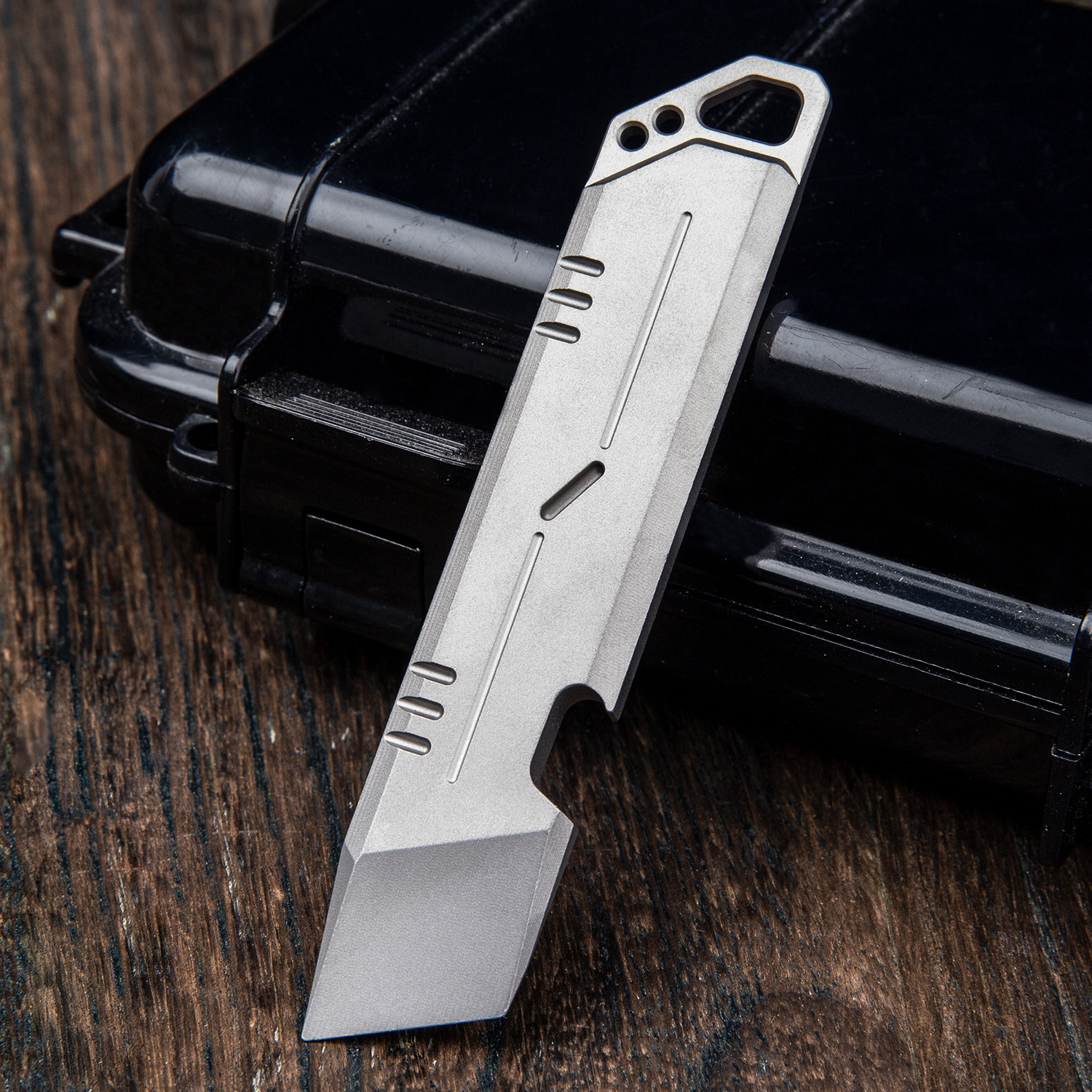 The titanium alloy crowbar multi-purpose EDC tool pick-up stick with an outdoor emergency kit.