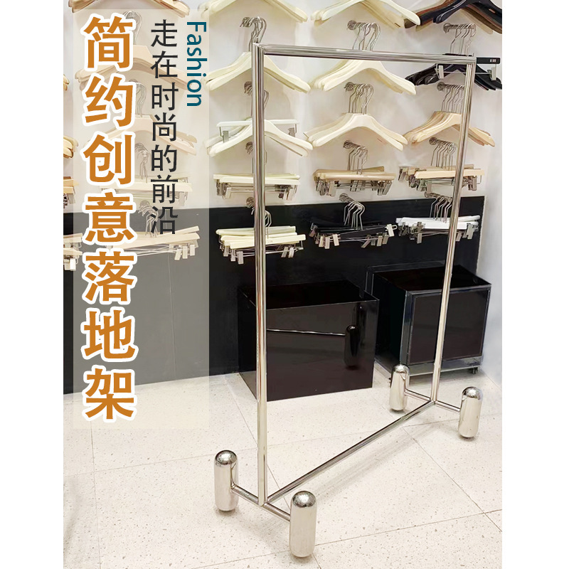 Guangdong popular dress shop displays stainless steel on the walls of a woman's clothing shelf