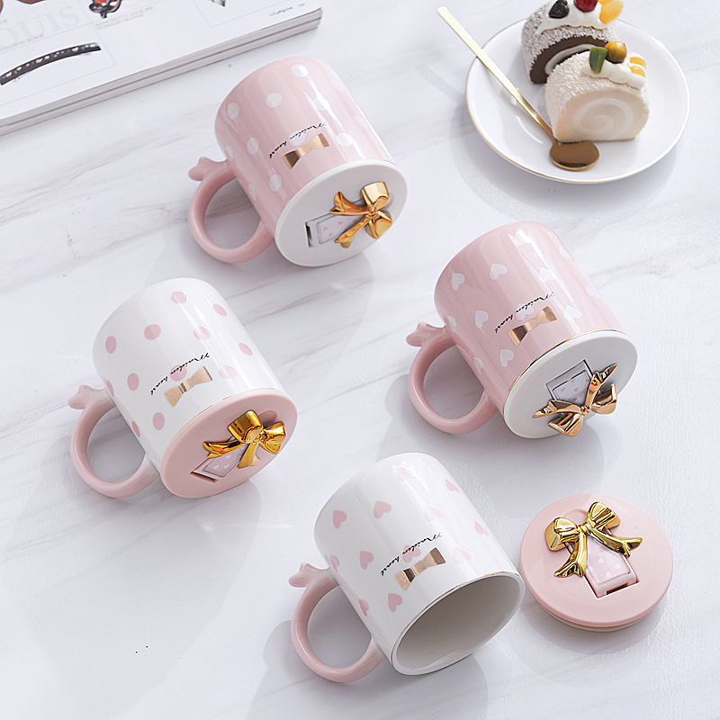 Cute cartoon pottery cup with a spoonful of Marc's cup of coffee.