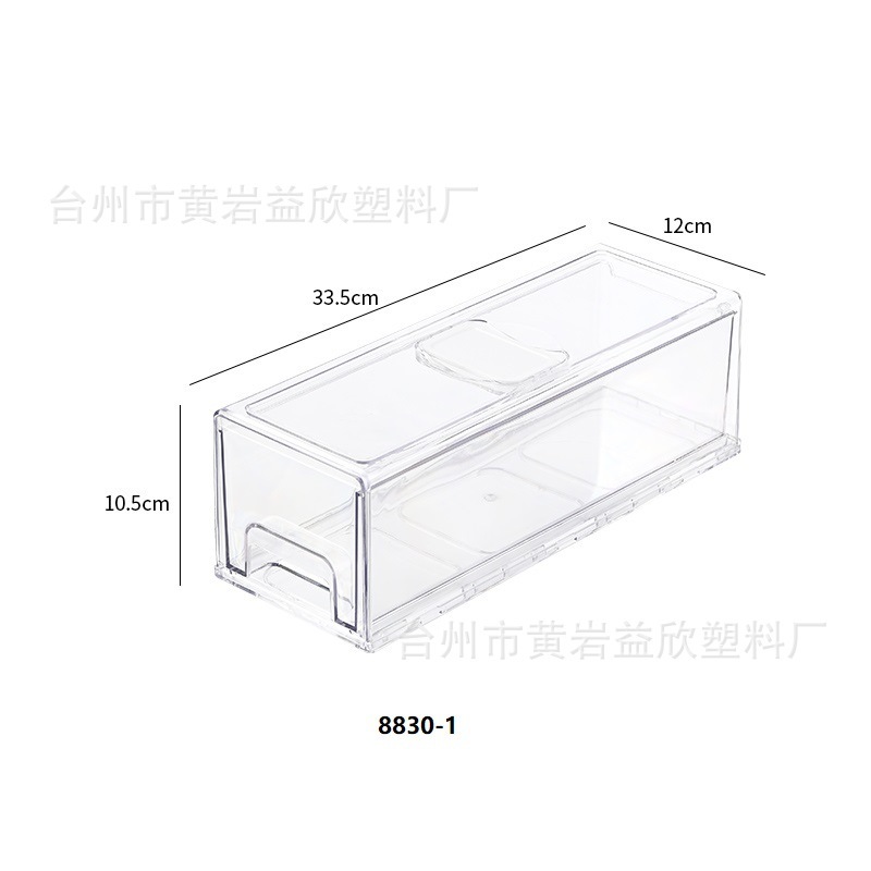 Một tủ lạnh dựa trên ngăn kéo với một tủ lạnh trái cây với một hộp đựng kẹo.