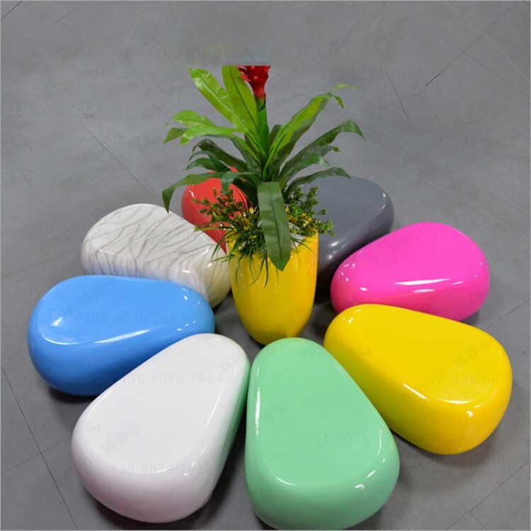 Glass and steel pebble stool.