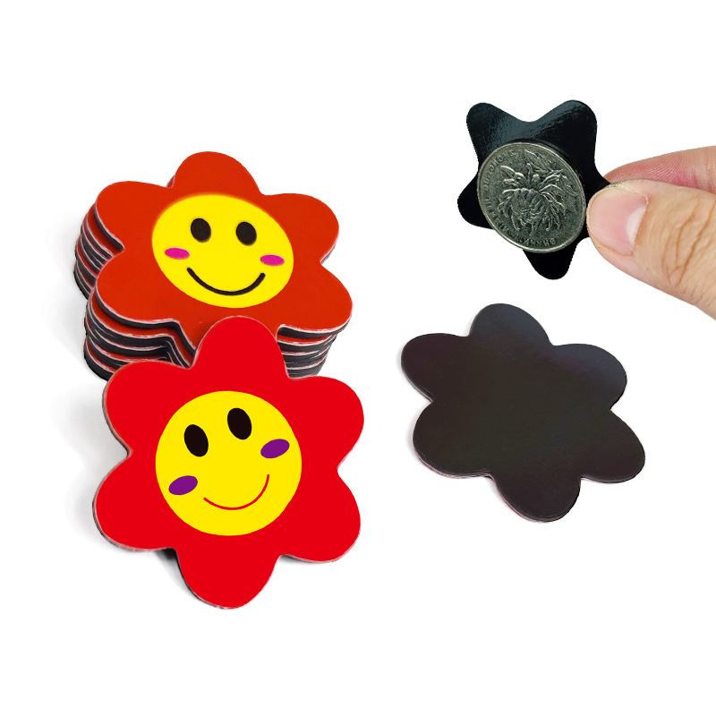 Magnetic reward to mark Star Baby Kindergarten's little red flower fridge with a smiley thumb.