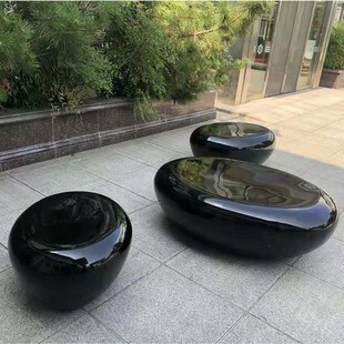 Glass and steel pebble stool.