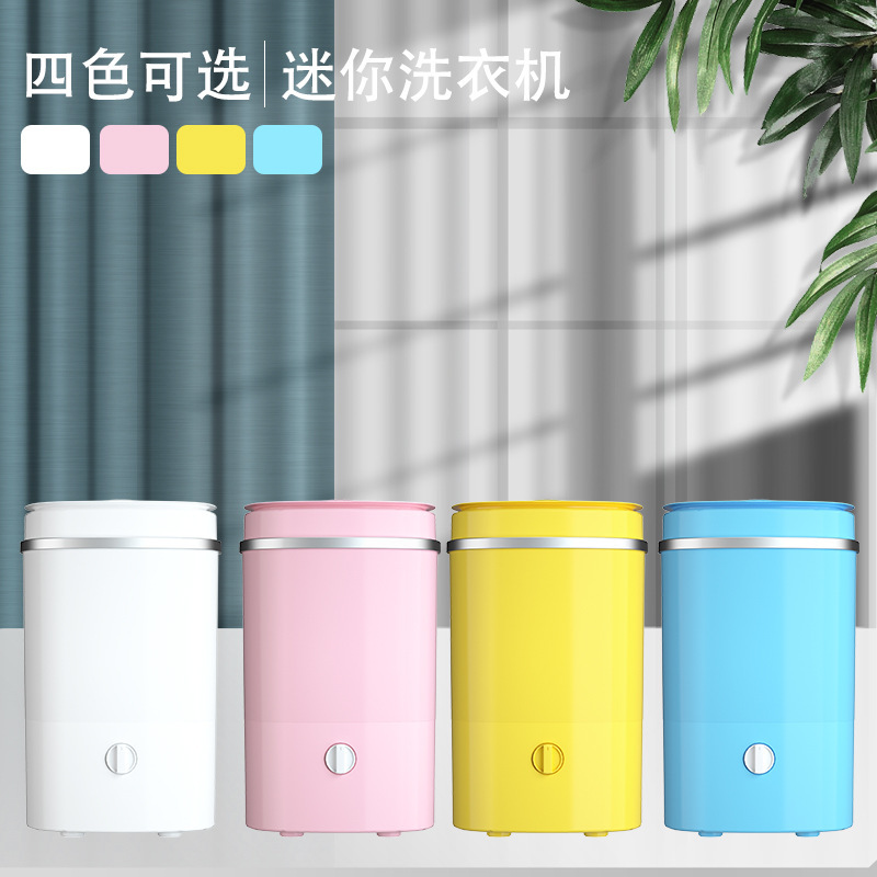 Những thùng nhỏ màu đỏ của những chiếc máy giặt mini với máy giặt bán tự động với giỏ nhựa đường.