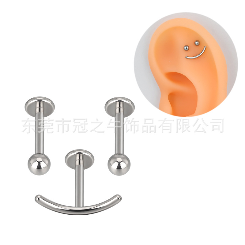 F136/G23 titanium alloys with a smile-faced ear nail in their insides.