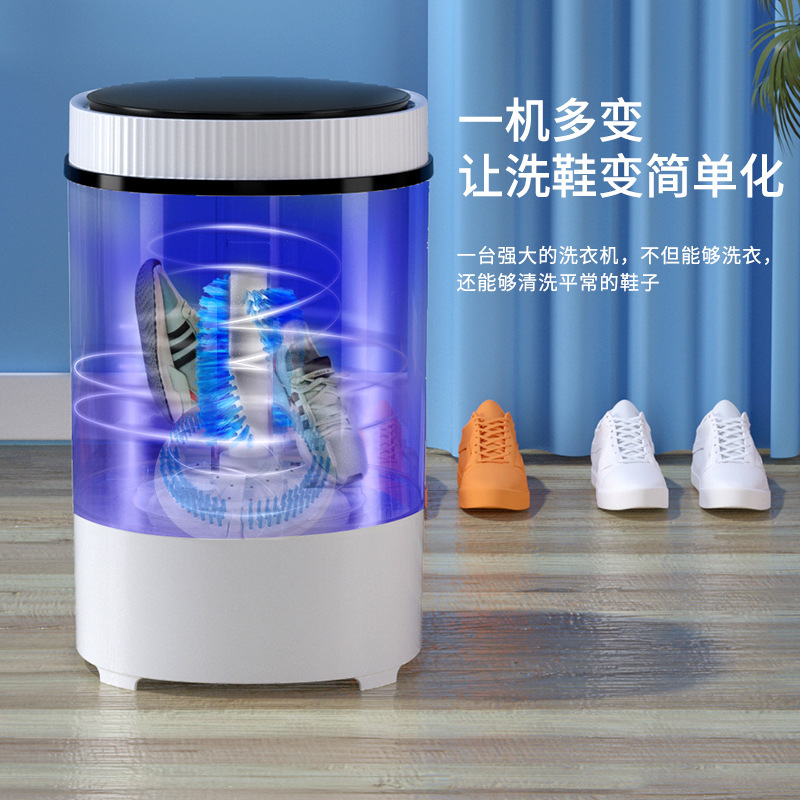 Một bộ máy giặt lớn màu đỏ với một máy xách tay đơn-cylider mini-cylinder với một nửa nhựa đường.