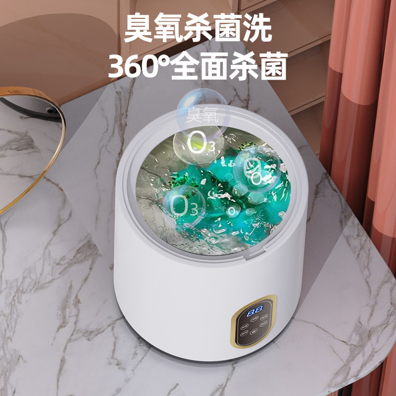 Máy giặt nhỏ, máy giặt tự động, tất em bé và phòng ngủ em bé.