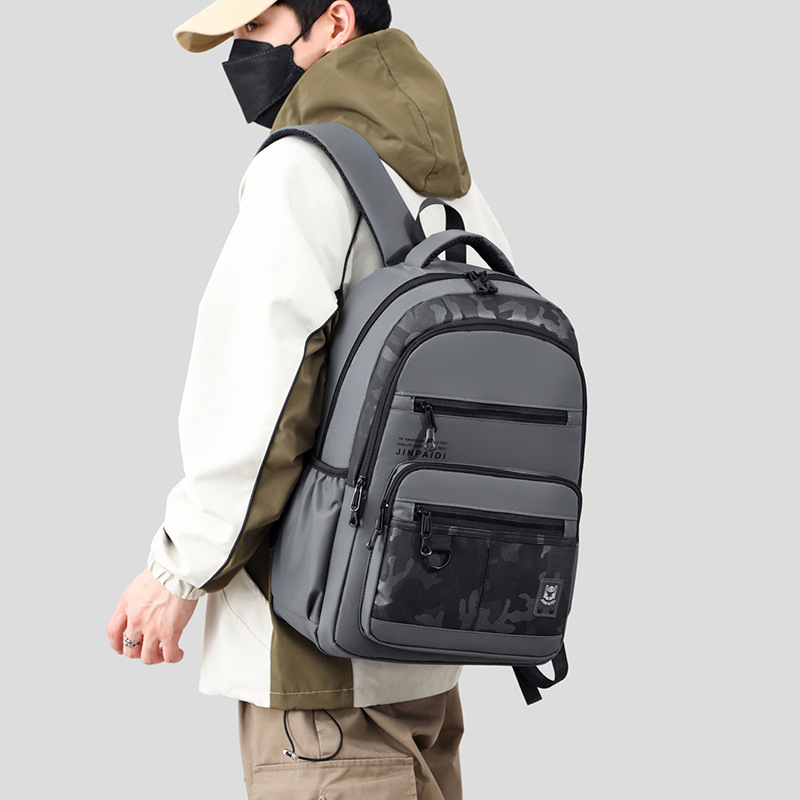 The factory distributes new money for double-shouldered men travelling on a waterproof, high-capacity computer backpack to facilitate travel.