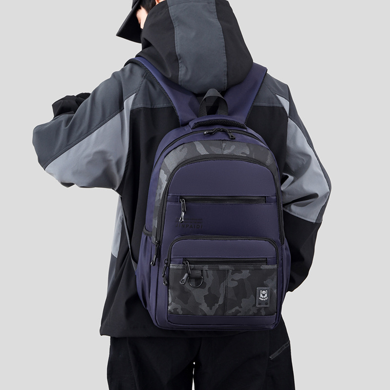 The factory distributes new money for double-shouldered men travelling on a waterproof, high-capacity computer backpack to facilitate travel.