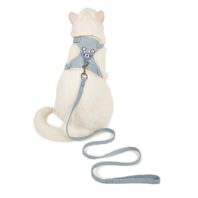 The pet tow rope vests the cat's chest to protect him from the teddy bear.