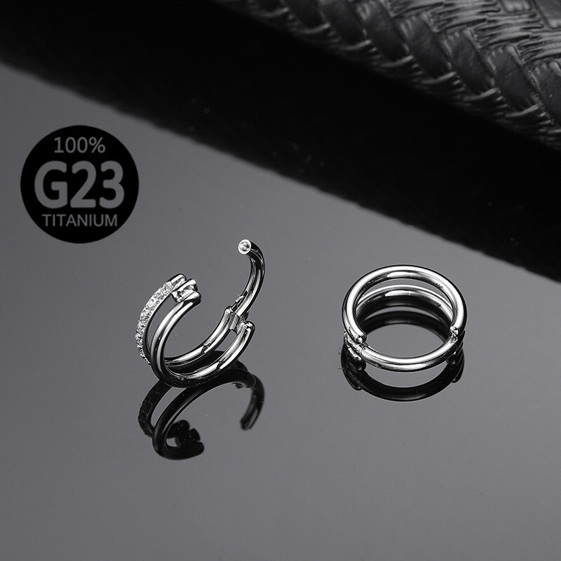 G23 body piercing double-coloured cylindrical noserings and nose nails.