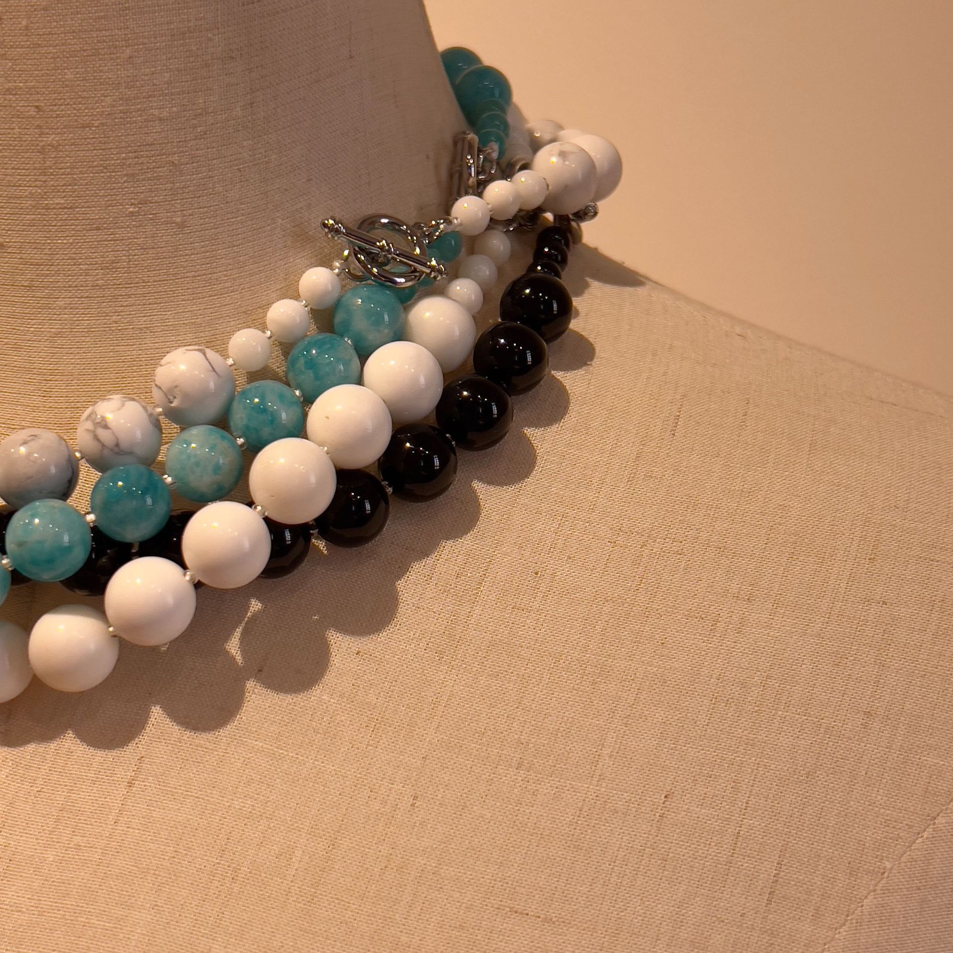 They designed the natural stone necklace.