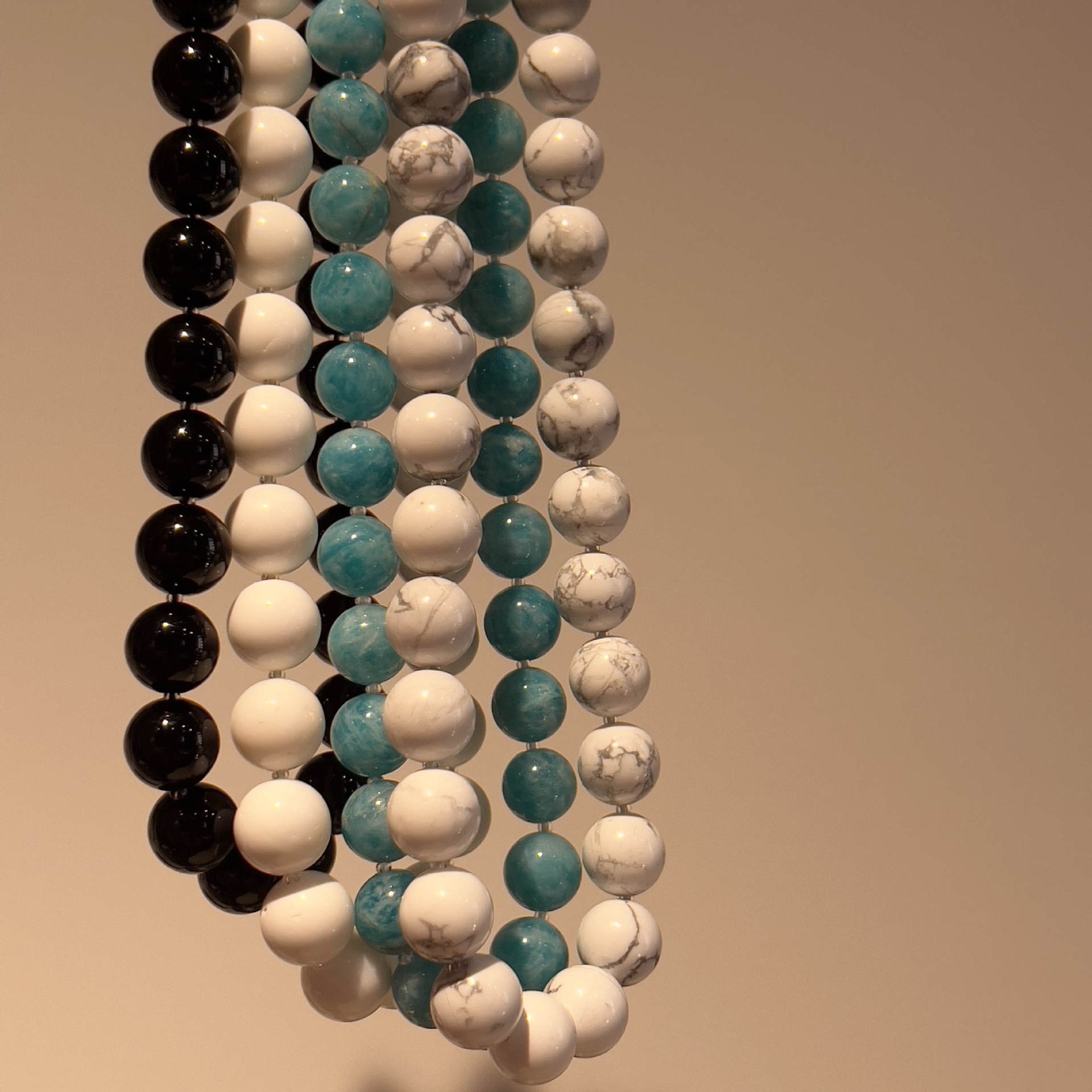 They designed the natural stone necklace.