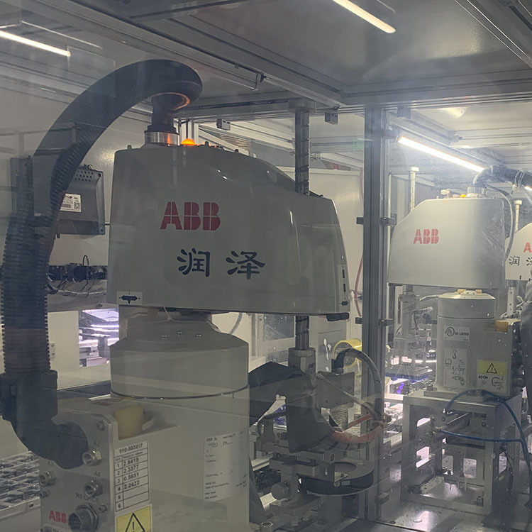 ABB's machineman, six-axis joint robot, load code top and bottom, automating Shenzhen plant.