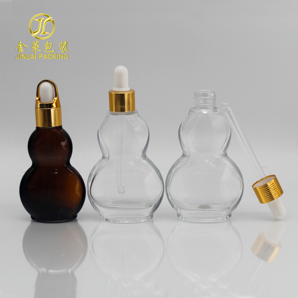 A 30-ml flat-tangled oil bottle, 50 ml brown glass spray emulsion bottle, transparent live oil roller.