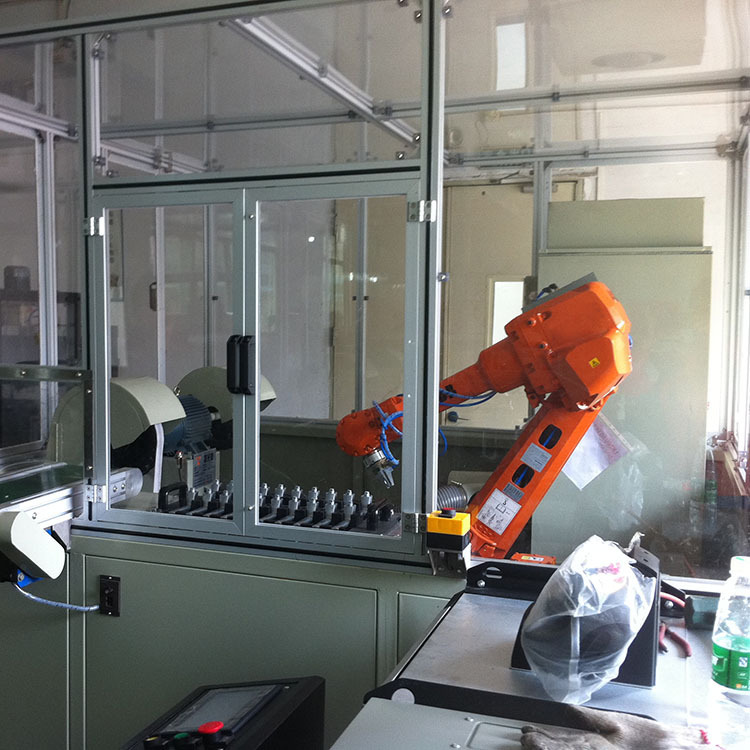 ABB's machineman, six-axis joint robot, load code top and bottom, automating Shenzhen plant.