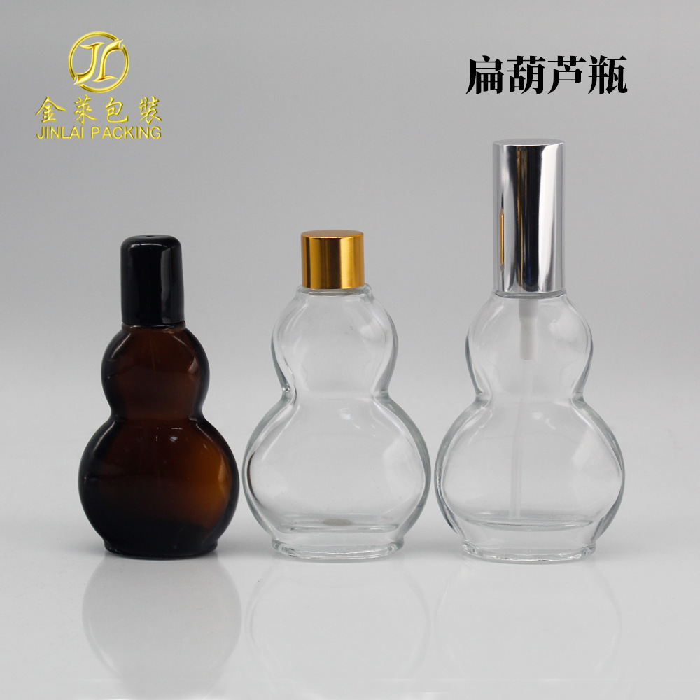 A 30-ml flat-tangled oil bottle, 50 ml brown glass spray emulsion bottle, transparent live oil roller.