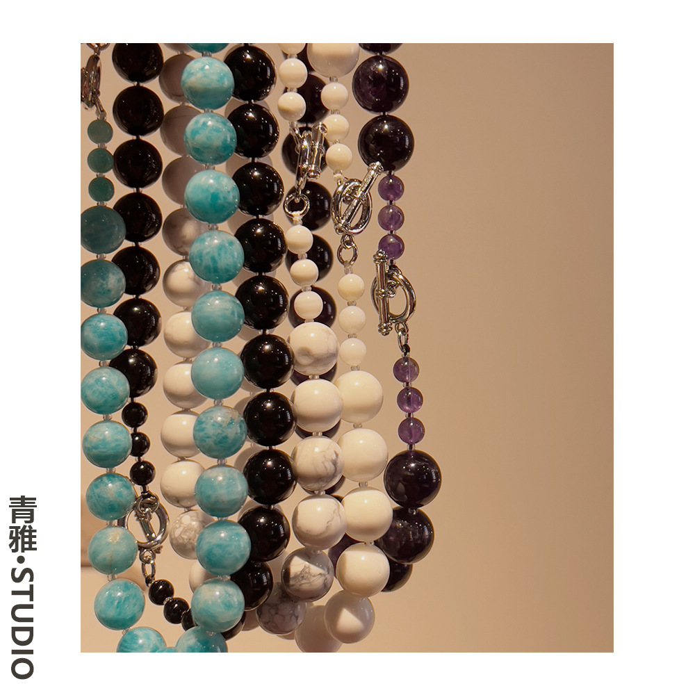 They designed the natural stone necklace.