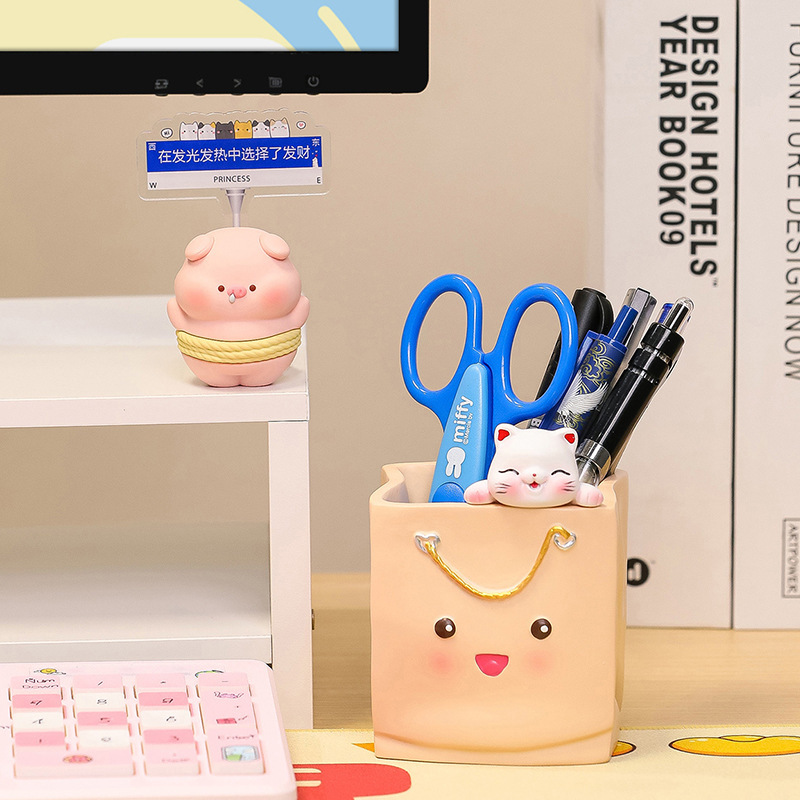 A pen full-capacity student desktop box with a girl's make-up brush at the top-cut desk.