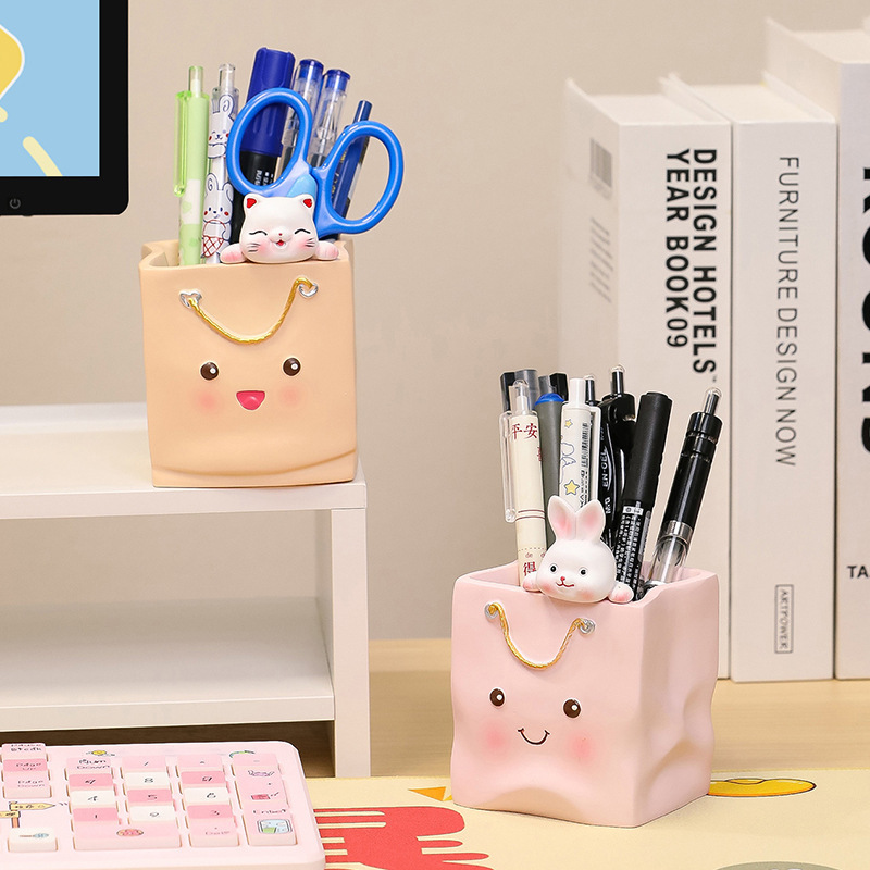 A pen full-capacity student desktop box with a girl's make-up brush at the top-cut desk.