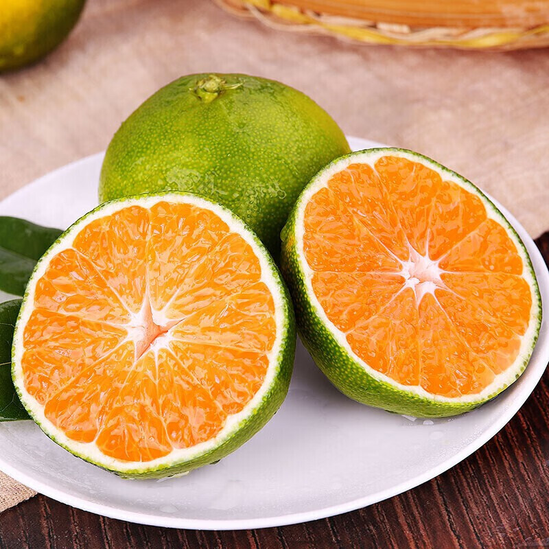 The green, orange, fresh fruit harvest from Yunnan mountains can be delivered directly from a small production site.