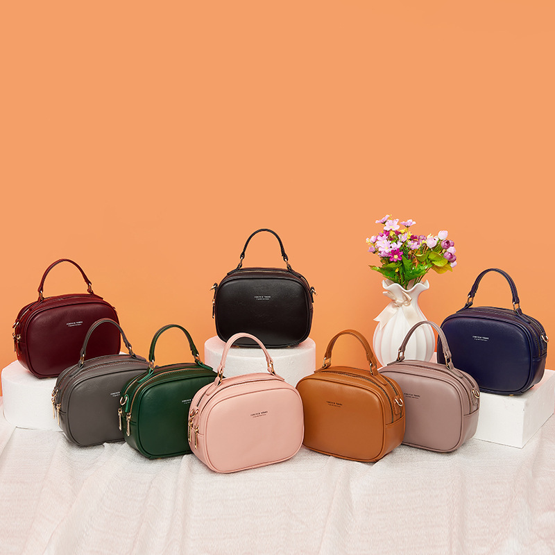 Female double-chained zipper handbags, one-shoulder-slashed handbags, mother-in-law, pure-coloured.