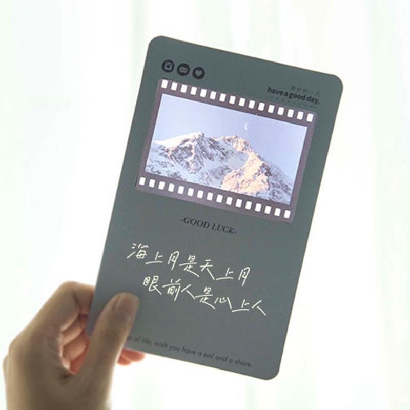 The film bookmark customised the flash card to write a message blank for the white couple's inverted film frame.