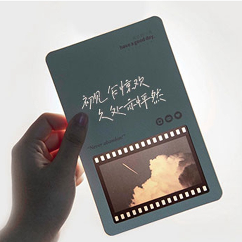 The film bookmark customised the flash card to write a message blank for the white couple's inverted film frame.