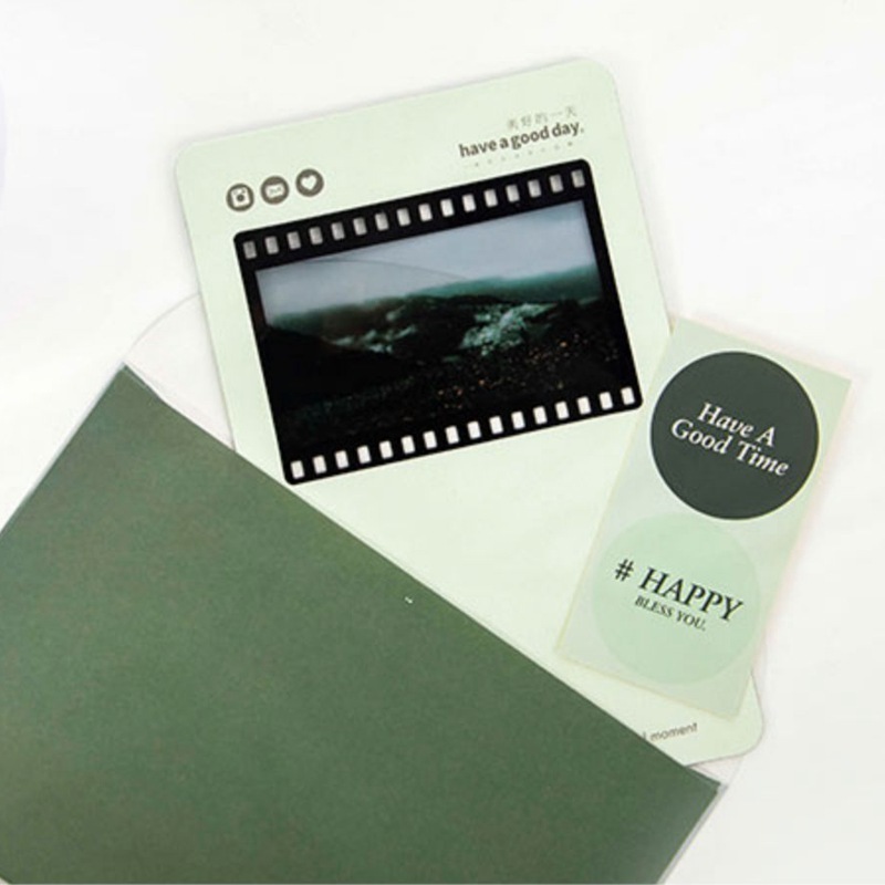 The film bookmark customised the flash card to write a message blank for the white couple's inverted film frame.