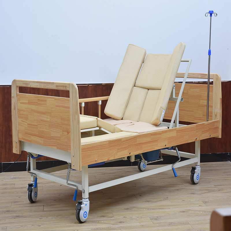 A multi-purpose nursing home bed with a side-sliding hand on the side.