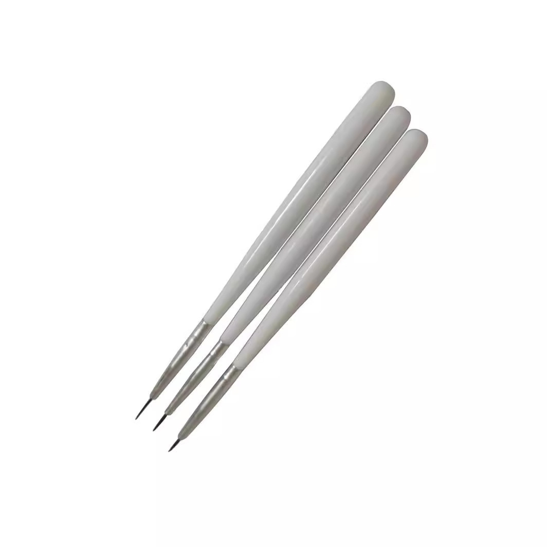 Three pairs of nails with a white pole and a brush with a brush and a brush.