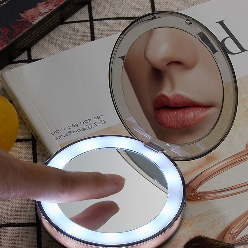 A Amazonled gift mirror with a round charge to hold the LED mirror together.