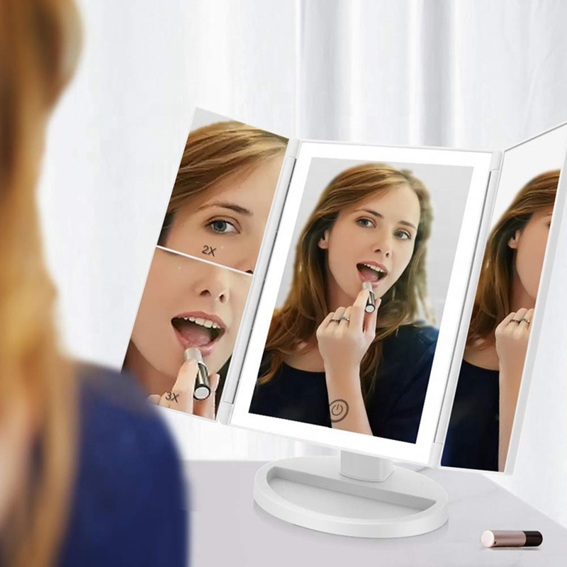 A three-faced makeup mirror with a light mirror.