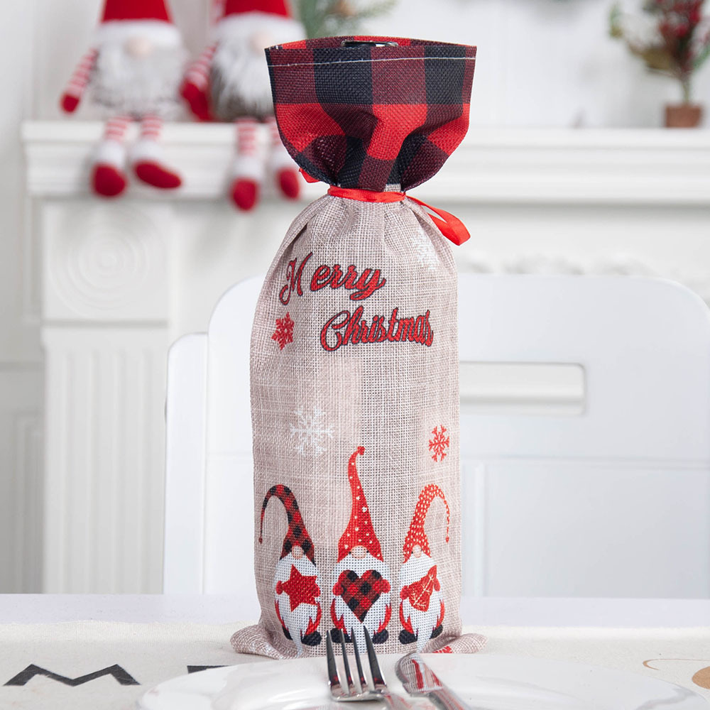 A Christmas bottle with a margarita bottle with a cute faceless old man bottle with a champagne bag table.