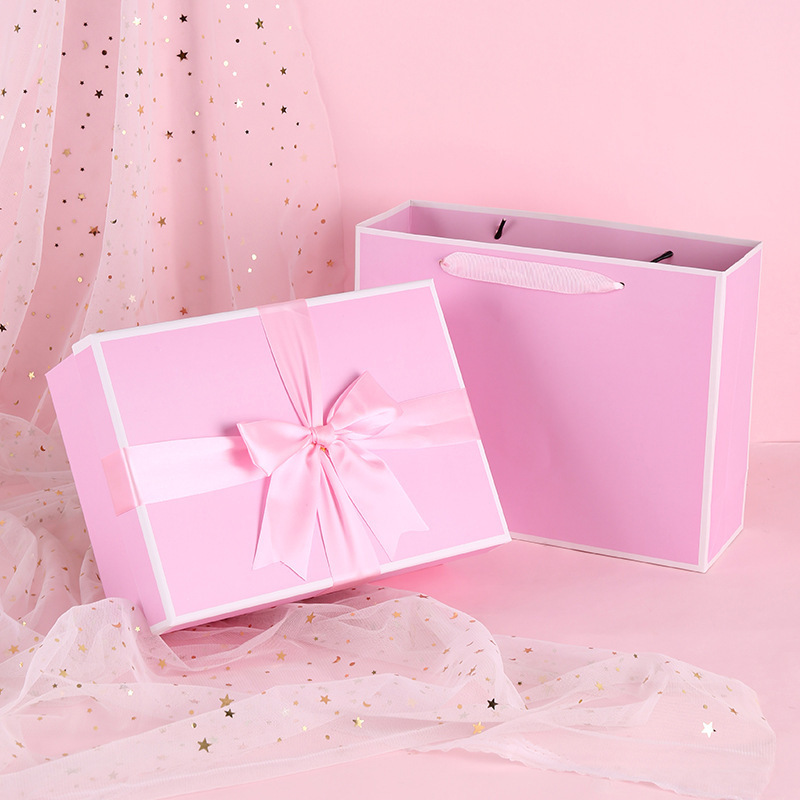 An empty box for the spot price box with pink butterflies tied to the valentine's holiday gift box.