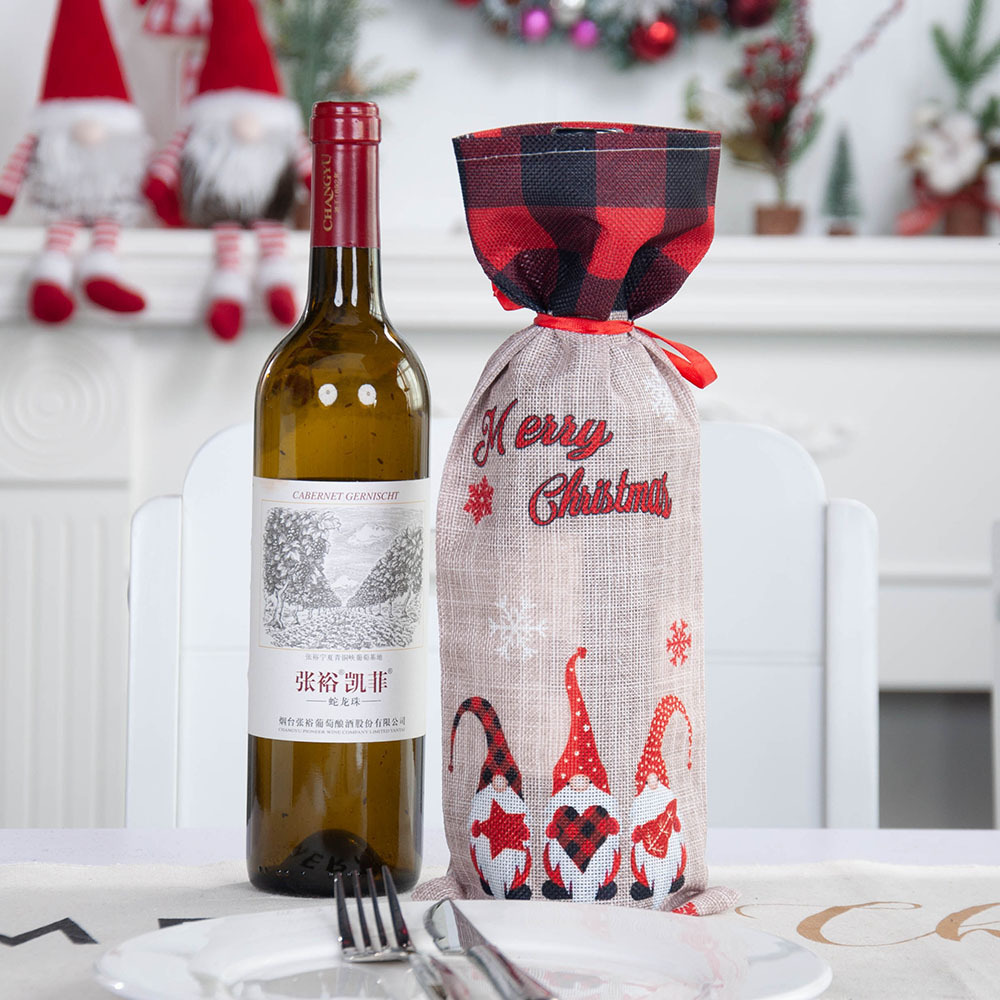 A Christmas bottle with a margarita bottle with a cute faceless old man bottle with a champagne bag table.