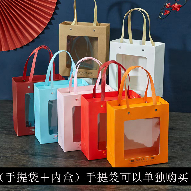 The birthday gift bag with an open window bag with a transparent handbag with an orange wedding bag with a towel.