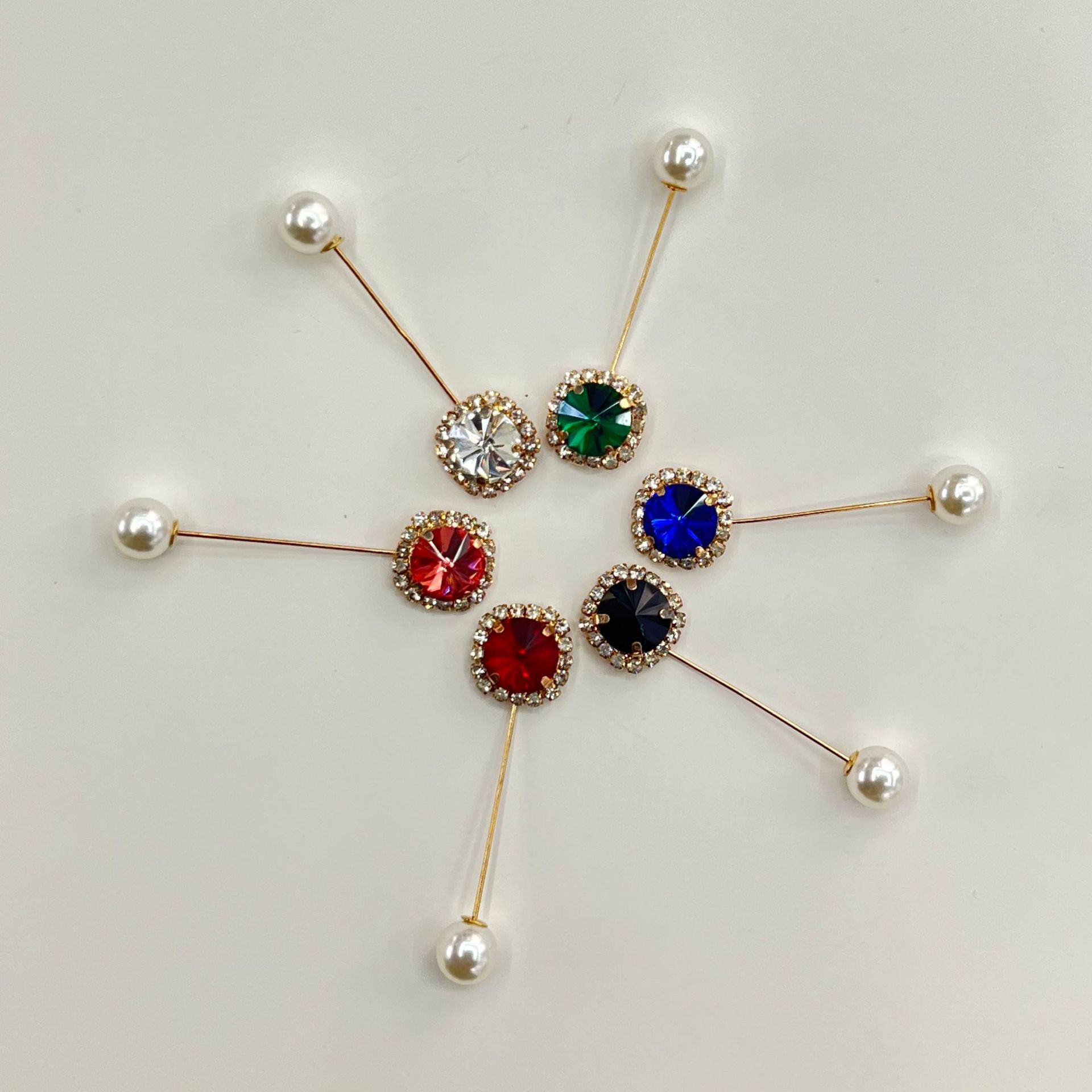 Colored cylindrical brooch. Fashion crystal with multiple shapes.