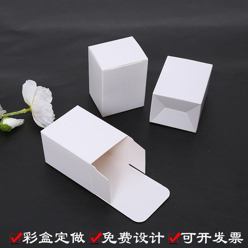 A white box with a white square box with a white folded white card card card box and a colour box with a white box