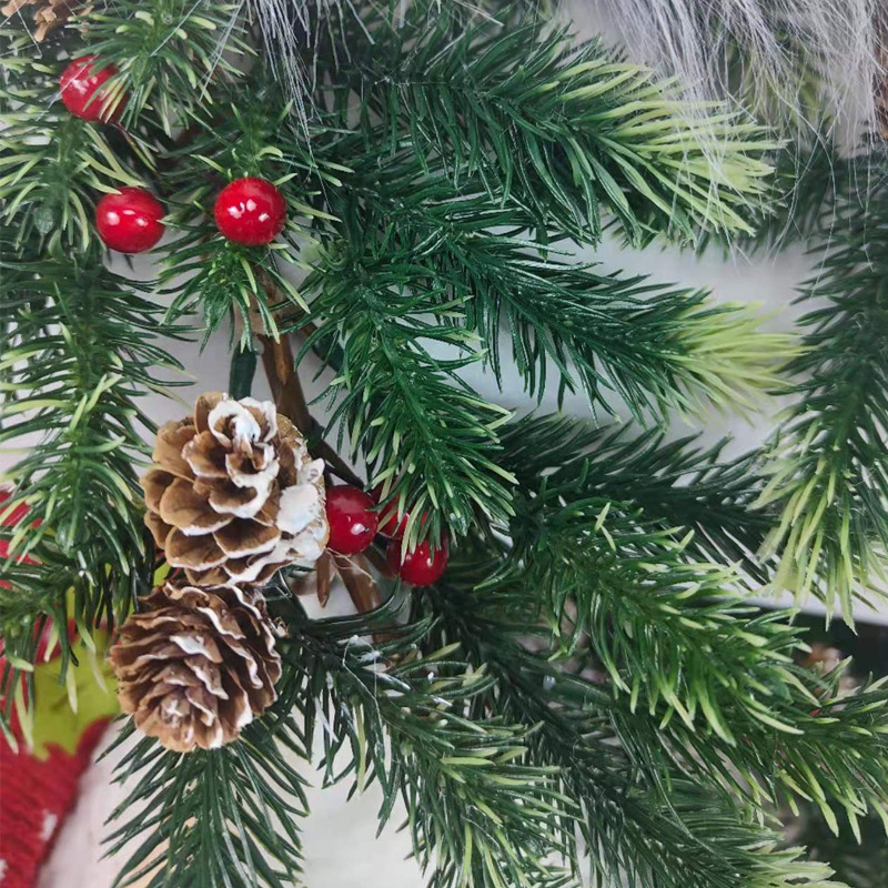 Processing custom-made Christmas decorations, a faceless old man with a lighted Christmas tree.