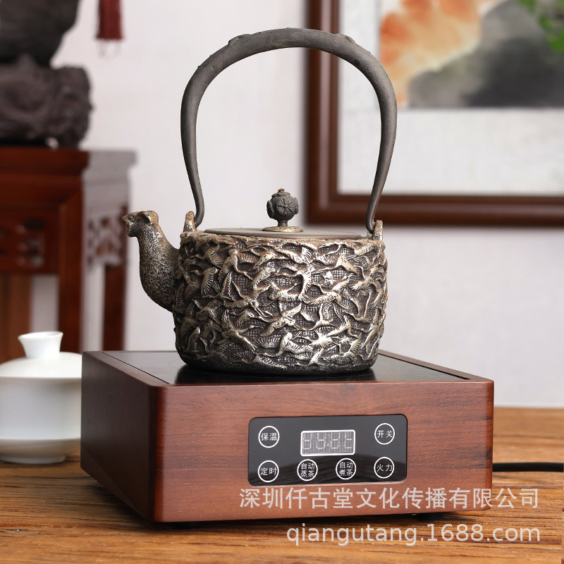 A small tea stove with a mini-glass hot-burning kettle of electric magnetic furnaces.