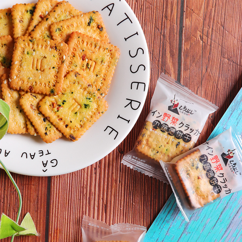 A box full of red biscuit in a small tea snack and leisure day, nine types of vegetable cookie small-packed office.