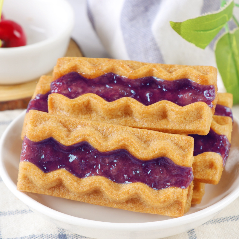 Blueberry cookies, red strawberry-fruit food, tea and jam cookies.