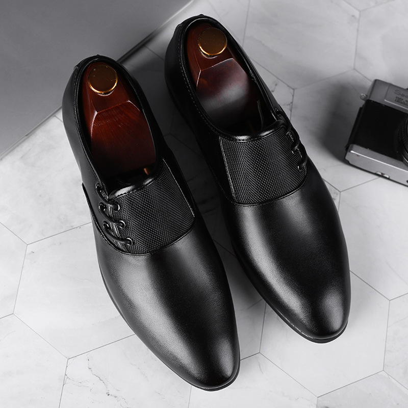 A man's shoes with his feet on business and leisure shoes.