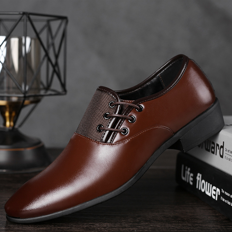 A man's shoes with his feet on business and leisure shoes.