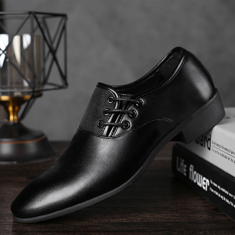 A man's shoes with his feet on business and leisure shoes.