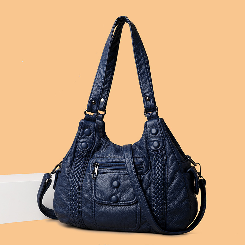 The new 2022 Korean version of the high-capacity water-washing middle-aged lady with a one-shoulder handbag and a free-slip bag across the border.