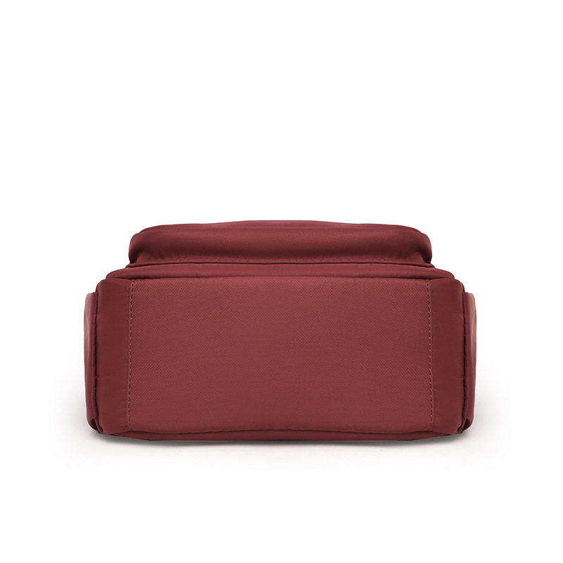 The one-shoulder-carrying, one-shoulder-free lady with a large waterproof nylon bag.