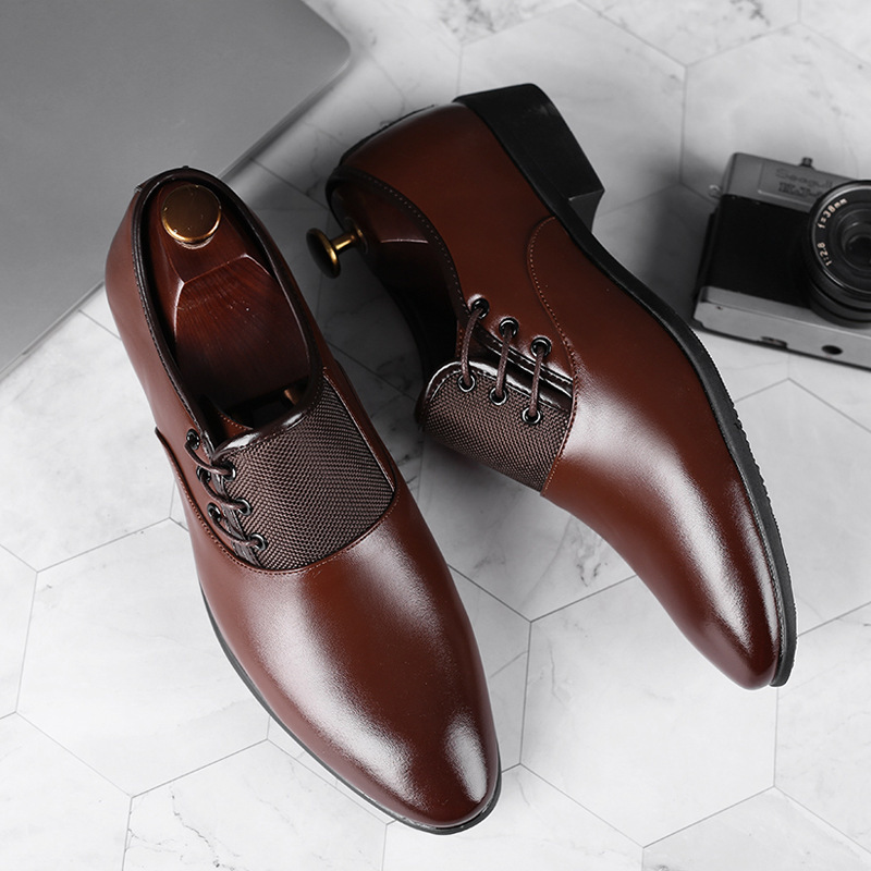 A man's shoes with his feet on business and leisure shoes.